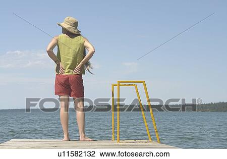 Woman on dock; Canada, Manitoba, Riding Mountain National Park View Large Photo Image Stock Image - Woman on dock; Canada, Manitoba, Riding Mountain National Park. Fotosearch