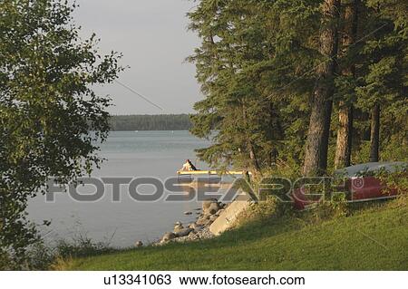 Woman on dock Clear Lake; Canada, Manitoba, Riding Mountain National Park View Large Photo Image Stock Image - Woman on dock Clear Lake; Canada, Manitoba, Riding Mountain National Park. Fotosearch