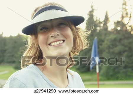Stock Image - Woman on organic golf course, Clear Lake Golf Course, Riding Mountain National Park, Manitoba, Canada. Fotosearch