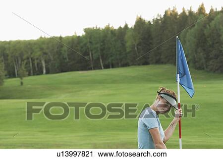 Woman on putting green, organic golf course, Clear Lake Golf Course, Riding Mountain National Park, Manitoba, Canada View Large Photo Image Stock Image - Woman on putting green, organic golf course, Clear Lake Golf Course, Riding Mountain National Park, Manitoba, Canada. Fotosearch