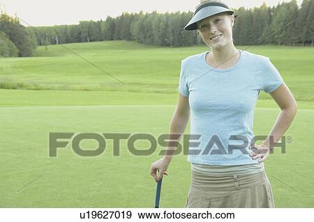 Woman wearing hemp shirt on organic golf course, Clear Lake Golf Course, Riding Mountain National Park, Manitoba, Canada View Large Photo Image Stock Photo - Woman wearing hemp shirt on organic golf course, Clear Lake Golf Course, Riding Mountain National Park, Manitoba, Canada. Fotosearch