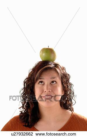 Young girl w/apple on head, Regina, Saskatchewan View Large Photo Image Stock Image - Young girl w/apple on head, Regina, Saskatchewan. Fotosearch