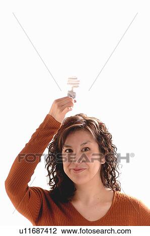 Stock Image - Young girl w/Light bulb on head, Regina, Saskatchewan. Fotosearch