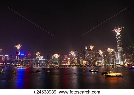Stock Photo - 2007 New Years Eve Fireworks Celebration, Hong Kong, Hong Kong Island skyline at night. Fotosearch