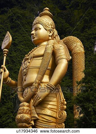 Stock Photograph - Batu Caves, A large statue of Lord Murugan. Fotosearch