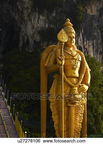 Batu Caves, A large statue of Lord Murugan View Large Photo Image Stock Photograph - Batu Caves, A large statue of Lord Murugan. Fotosearch