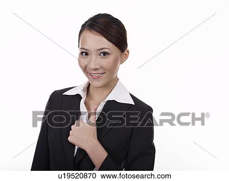 Stock Image - Businesswoman thumbs up. Fotosearch