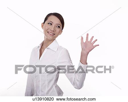 Businesswoman waving hand View Large Photo Image Stock Image - Businesswoman waving hand. Fotosearch