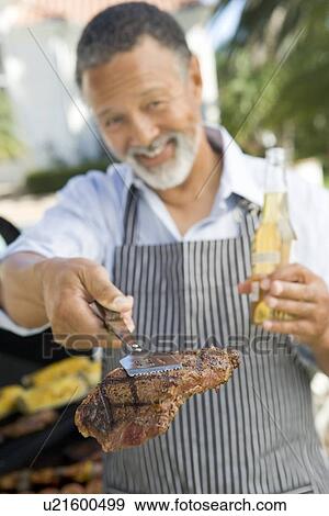 Man Barbequing In A Garden View Large Photo Image Stock Photo - Man Barbequing In A Garden. Fotosearch
