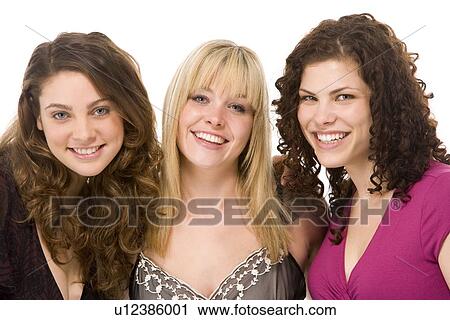 Stock Image - Portrait Of Three Women Smiling. Fotosearch
