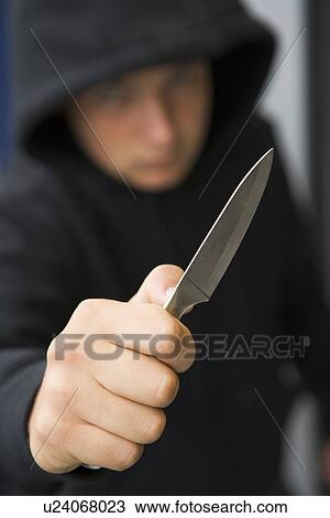 Stock Image - Teenage Boy Branding Knife. Fotosearch