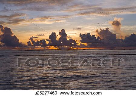 Beach in the evening glow, Saipan, USA View Large Photo Image Stock Image - Beach in the evening glow, Saipan, USA . Fotosearch