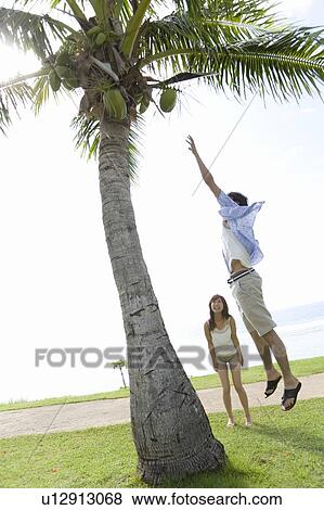 Young man jumping, Saipan View Large Photo Image Stock Photo - Young man jumping, Saipan. Fotosearch