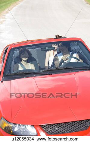 Young people in the car, man driving, Saipan, USA  View Large Photo Image Picture - Young people in the car, man driving, Saipan, USA . Fotosearch