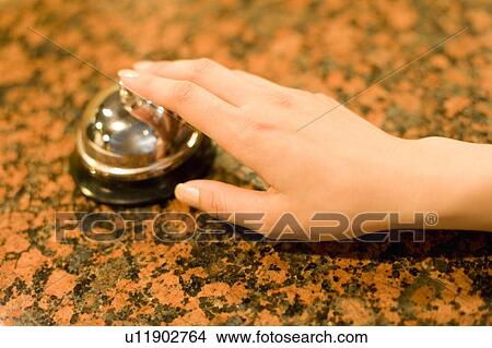 Young woman ringing a service bell, Saipan View Large Photo Image Picture - Young woman ringing a service bell, Saipan. Fotosearch