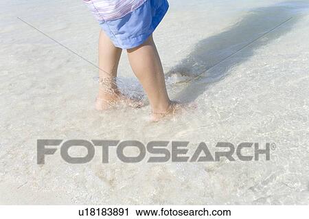 Young woman standing on beach, Saipan, USA View Large Photo Image Stock Image - Young woman standing on beach, Saipan, USA . Fotosearch
