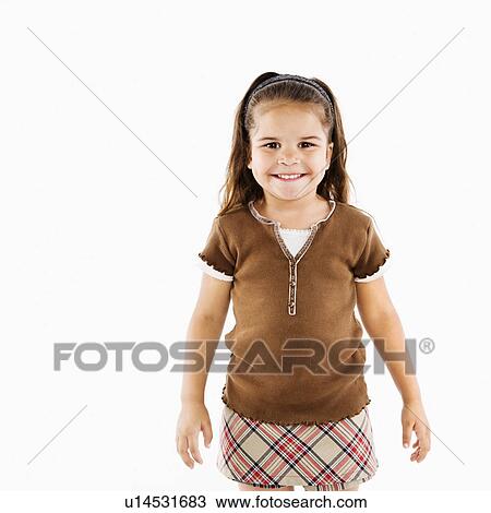 Stock Image - Adorable little hispanic girl standing smiling.. Fotosearch