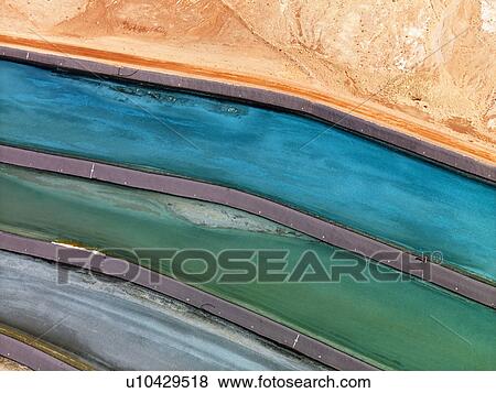 Stock Photo - Aerial detail of tailing ponds for mineral waste in rural Utah, United States.. Fotosearch