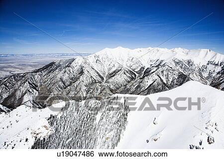 Stock Photograph - Aerial scenic of snowy Sangre De Cristo Mountains, Colorado, United States in winter.. Fotosearch