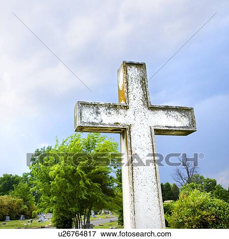 Cross in graveyard against blue sky and clouds. View Large Photo Image Stock Photo - Cross in graveyard against blue sky and clouds.. Fotosearch