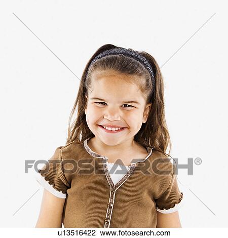Stock Image - Cute little girl standing smiling. Fotosearch