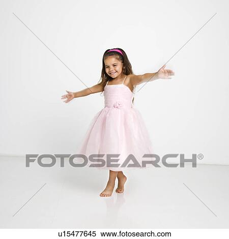 Cute little hispanic girl wearing pink dress dancing. View Large Photo Image Stock Photography - Cute little hispanic girl wearing pink dress dancing.. Fotosearch
