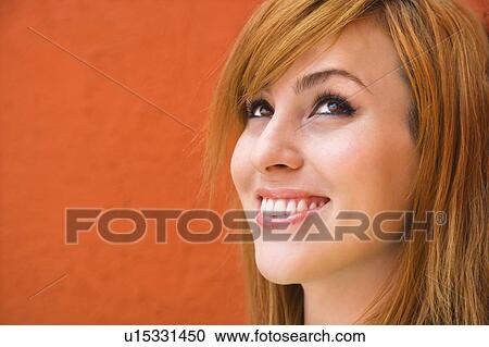 Stock Image - Female looking up. Fotosearch
