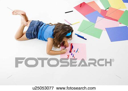 Stock Photo - Girl coloring on construction paper. Fotosearch