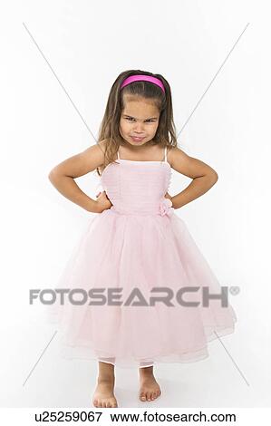 Stock Photo - Girl wearing pink dress pouting. Fotosearch
