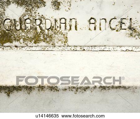 Stock Photography - Gravestone with words 'Guardian Angel' on it. Fotosearch