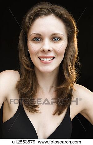 Stock Photo - Head and shoulders portrait of young adult female smiling. Fotosearch