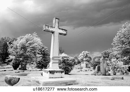 Stock Photo - Infrared graveyard scene with cross and gravestones.. Fotosearch