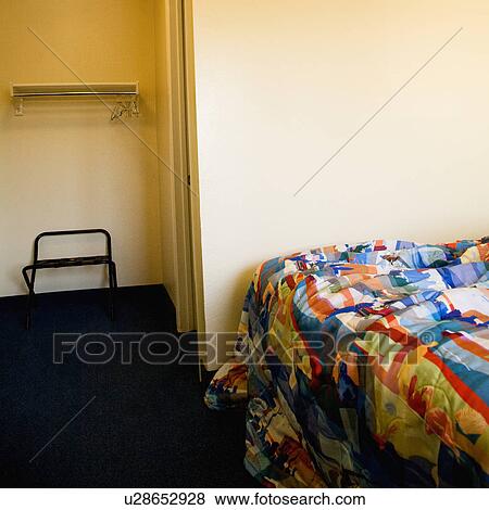 Interior shot of motel room with unmade bed and closet. View Large Photo Image Stock Photo - Interior shot of motel room with unmade bed and closet.. Fotosearch