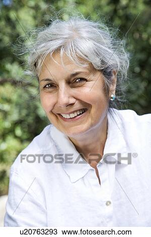 Middle aged Caucasian woman smilling at viewer. View Large Photo Image Stock Image - Middle aged Caucasian woman smilling at viewer.. Fotosearch