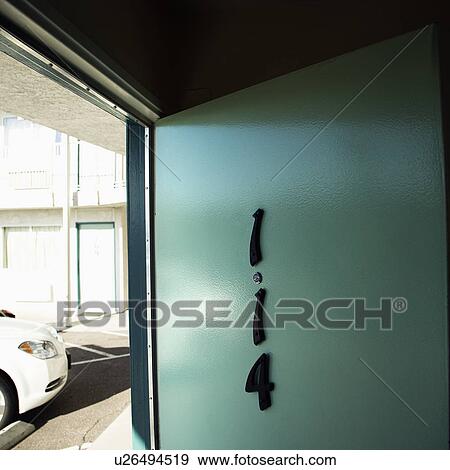 Motel room door on first floor that has been left open. View Large Photo Image Stock Photo - Motel room door on first floor that has been left open.. Fotosearch