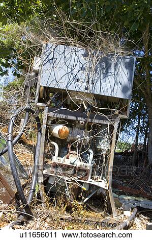 Old broken gasoline pump covered with weeds. View Large Photo Image Stock Image - Old broken gasoline pump covered with weeds.. Fotosearch