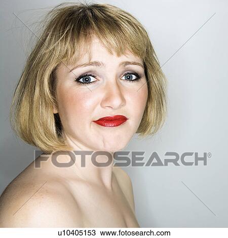 Portrait of young blonde caucasian woman who is looking at the viewer with sad expression. View Large Photo Image Stock Image - Portrait of young blonde caucasian woman who is looking at the viewer with sad expression.. Fotosearch