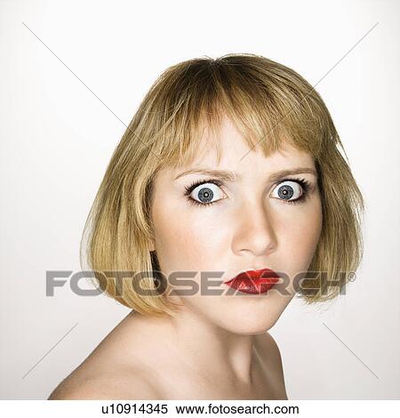 Portrait of young blonde caucasian woman who is looking at the viewer with confused expression. View Large Photo Image Stock Photography - Portrait of young blonde caucasian woman who is looking at the viewer with confused expression.. Fotosearch