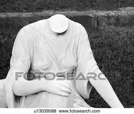 Stock Photo - Statue in graveyard of headless woman. Fotosearch