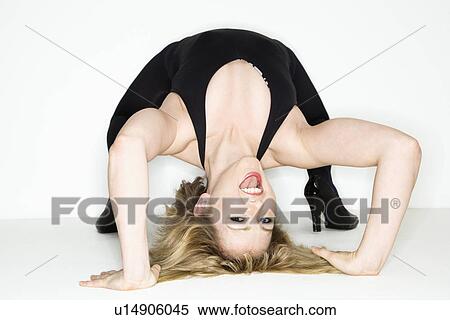 Woman doing backbend View Large Photo Image Stock Photography - Woman doing backbend. Fotosearch
