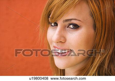 Stock Photo - Woman smiling at viewer. Fotosearch