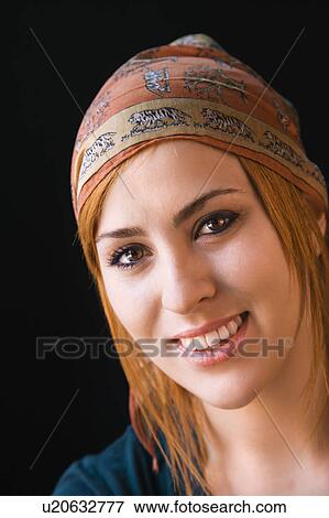 Woman wearing cap smiling View Large Photo Image Stock Photo - Woman wearing cap smiling. Fotosearch