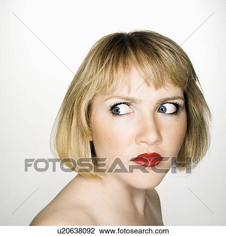 Stock Image - Woman who has suspicious expression. Fotosearch
