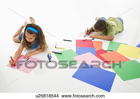 Young boy and girl coloring on construction paper and smiling View Large Photo Image Picture - Young boy and girl coloring on construction paper and smiling. Fotosearch