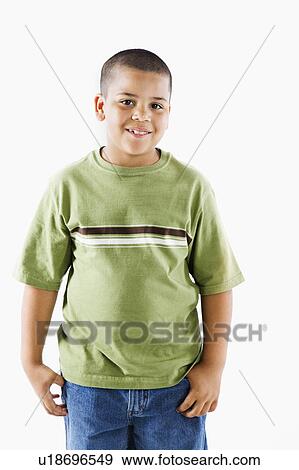 Stock Photo - Young latino adolescent boy standing smiling.. Fotosearch