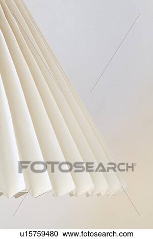 Accordion lampshade against white wall View Large Photo Image Stock Image - Accordion lampshade against white wall. Fotosearch