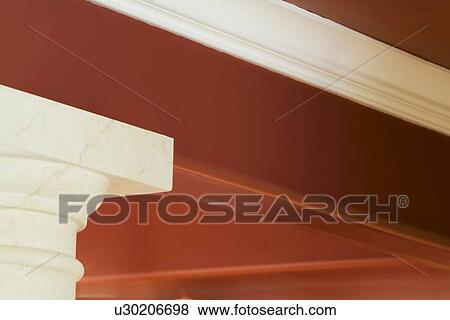 Stock Photo - Architectural detail top of column supporting red home ceiling. Fotosearch