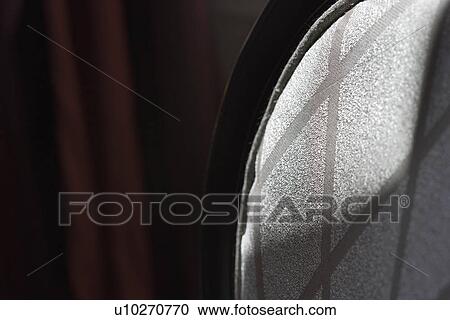 Back of silver cushioned dining chair View Large Photo Image Stock Image - Back of silver cushioned dining chair. Fotosearch
