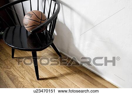 Basket ball in black captains chair View Large Photo Image Stock Image - Basket ball in black captains chair. Fotosearch