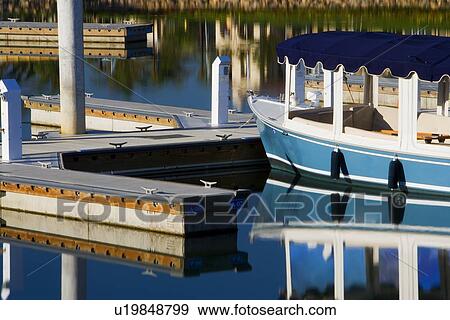 Boats docked at housing community near channel to ocean View Large Photo Image Stock Photo - Boats docked at housing community near channel to ocean. Fotosearch